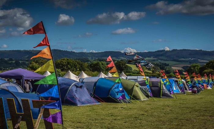 Flags, tent, sun, horizon at The Weekend Rumble